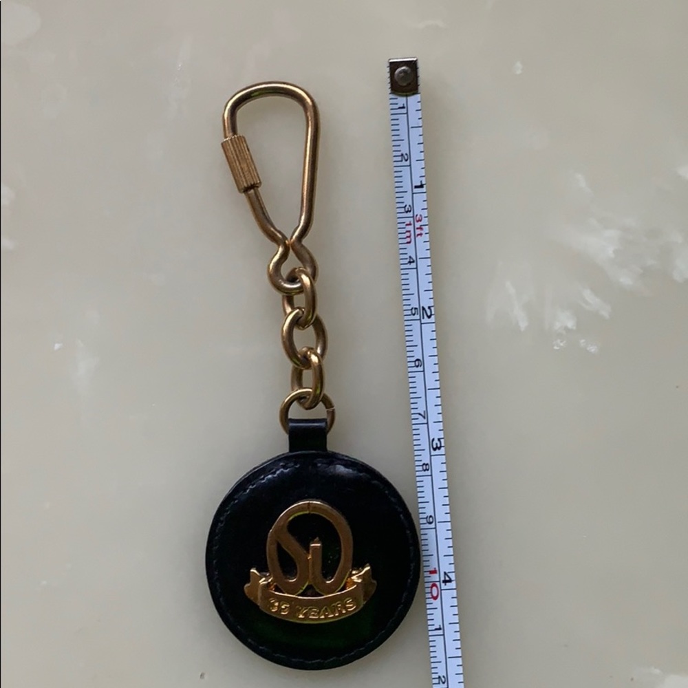 Vintage St. John Keychain 35 anniversary black and gold logo - Picture 10 of 10
